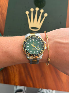 Rlx Oyster Master Bicolor Dorado Tablero Verde Bisel Negro