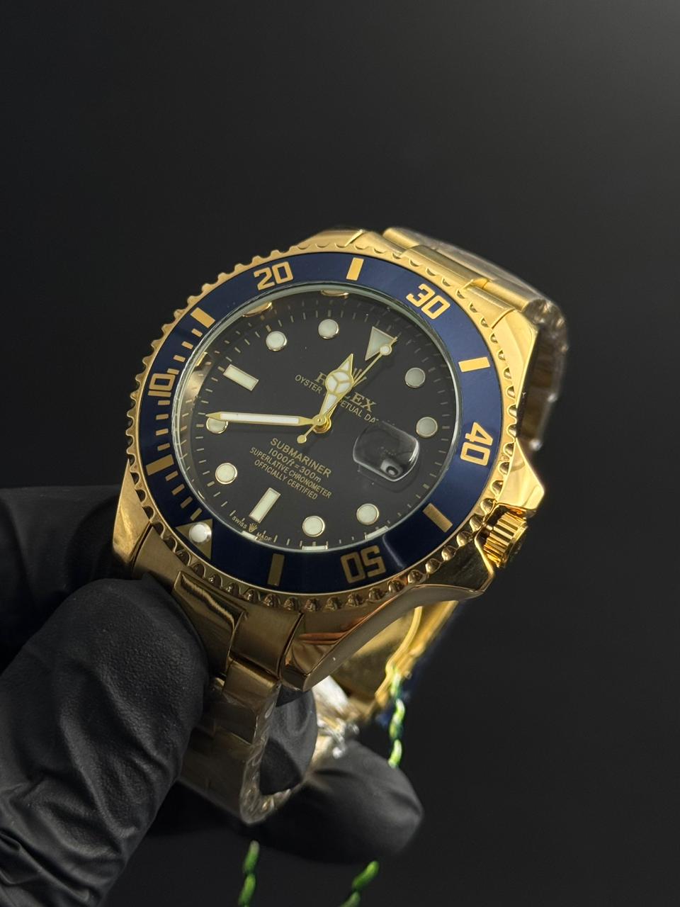 Rlx 2026 Submariner Dorado Tablero Negro Bisel Azul